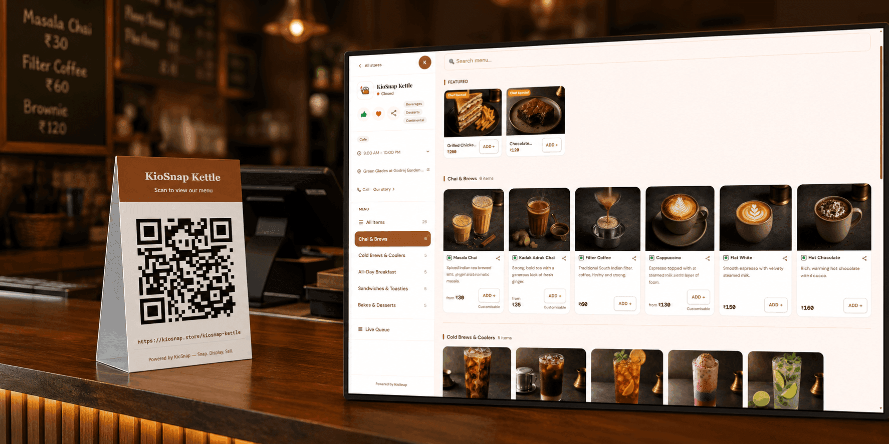 A KioSnap QR standee on a counter next to the live storefront